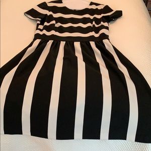 Black and white striped dress with pockets.